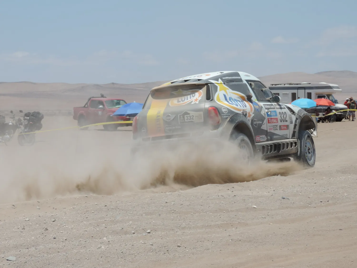 "Dakar 2014 - Bite my MINI dust (Poland)" by Sports Cars Fan is licensed under CC BY 2.0.