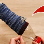 Užmaukite kojinę ant „Coca Cola“ butelio