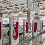 Tesla Supercharger / fokke baarssen / Shutterstock.com