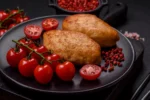 Įdaryti kotletai su pomidorais